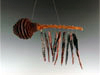 Obsidian Chime with Leucadendron Cone.  8" Long from Top of Hanger & 5 1/2" Wide.